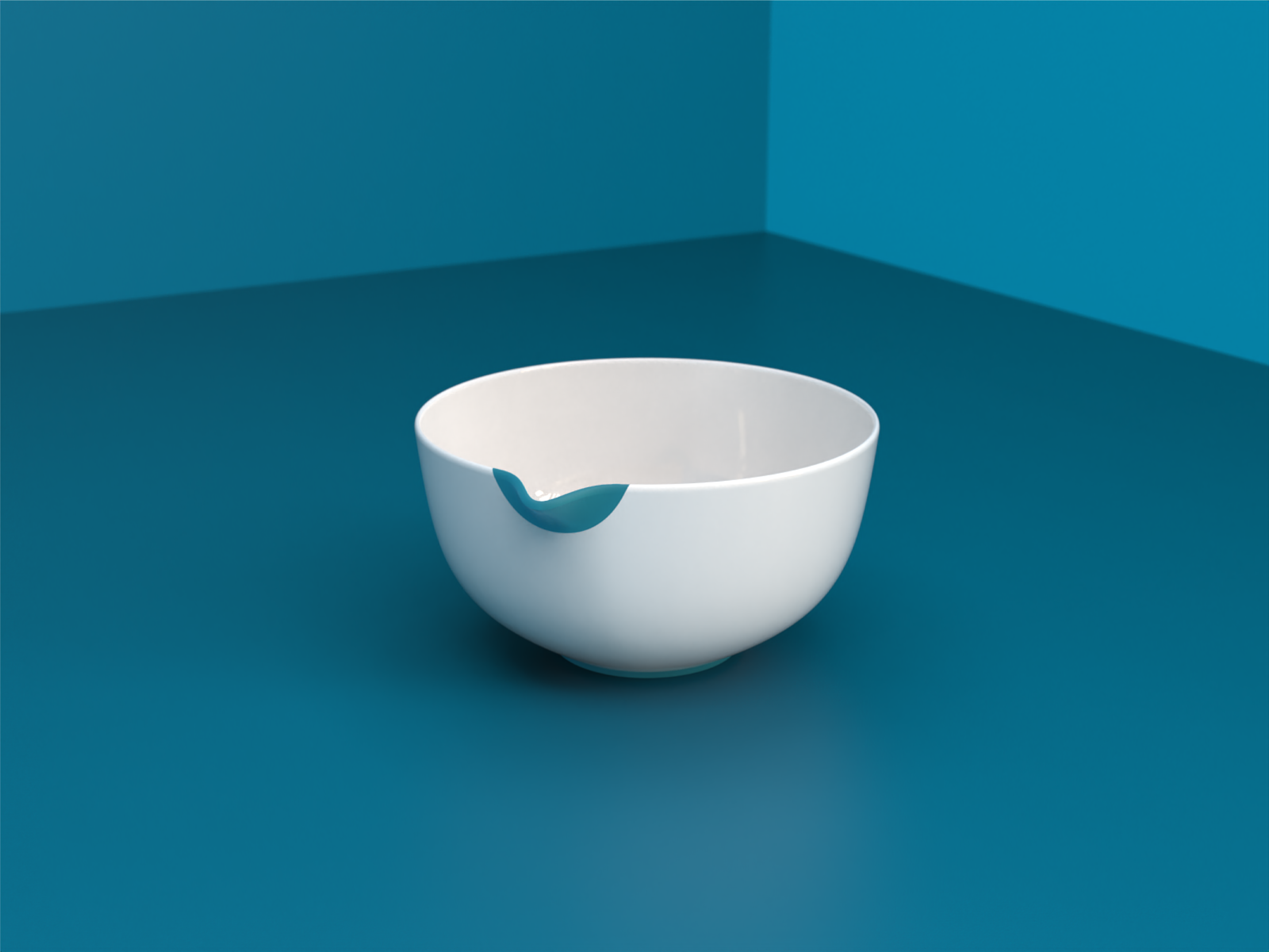 A white bowl with a blue compressible rim insert on a teal background.